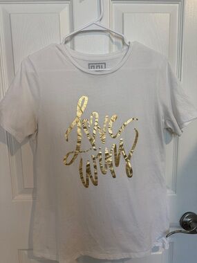 Emily McCarthy cream color Tee with Gold Foil Script “LOVE WINS”. 100% PIMA cot